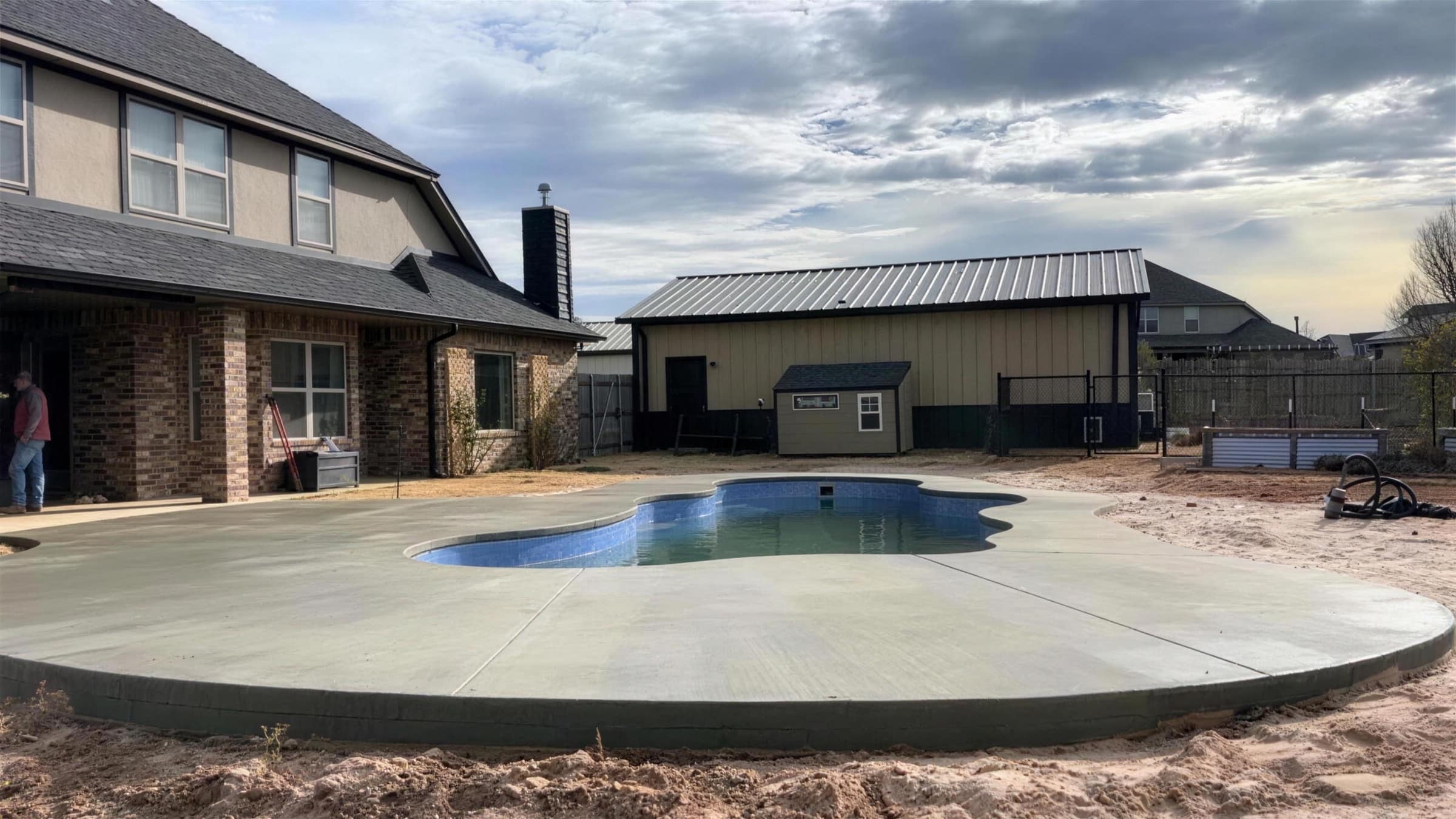 Freshly poured concrete pool deck by Snell Concrete & Construction in Missouri